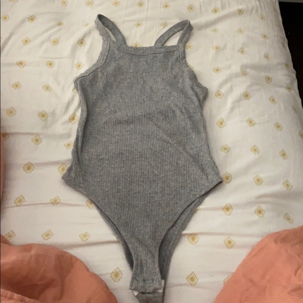 Out from under gray body suit